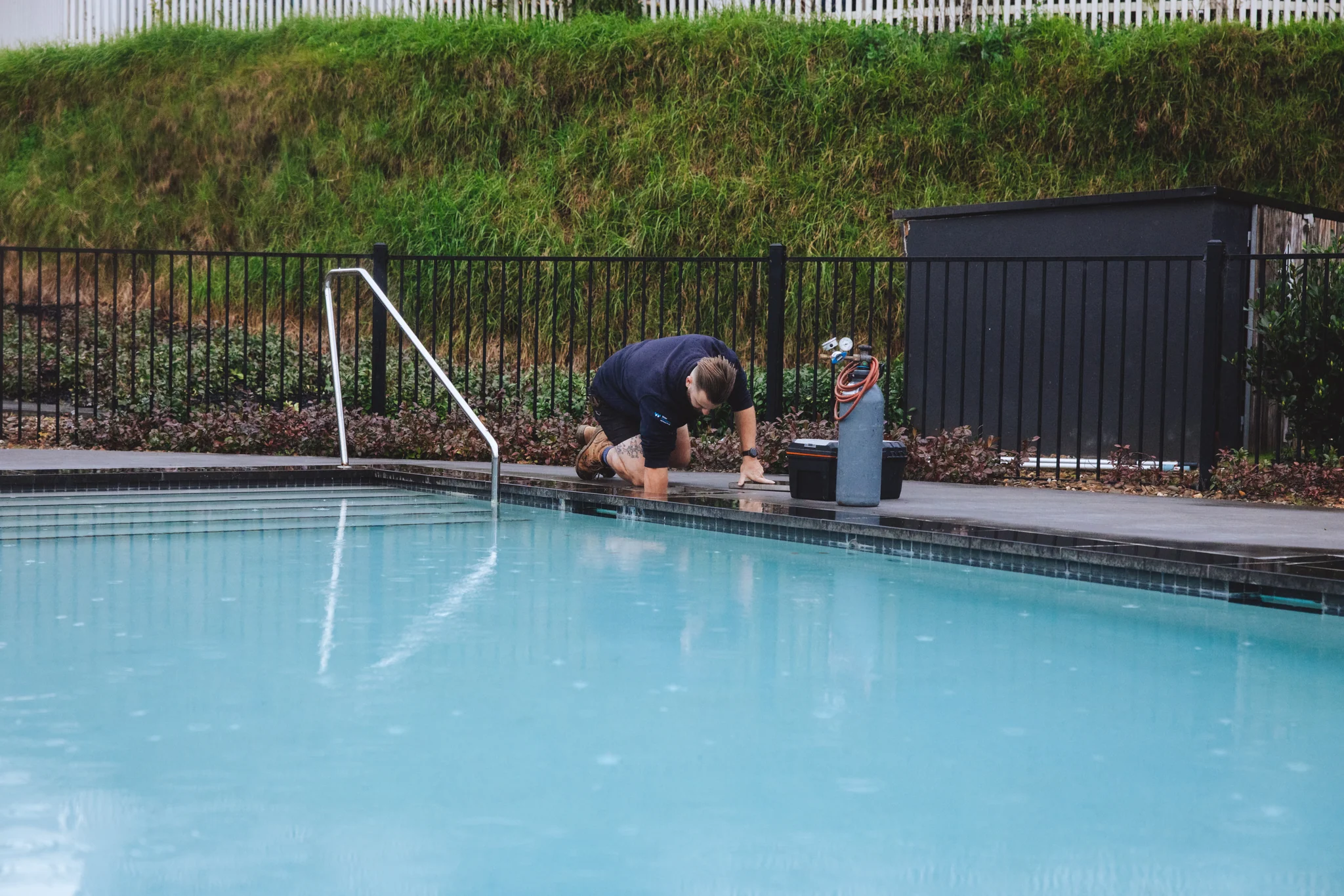 ALD specialist inspecting a residential swimming pool for water loss