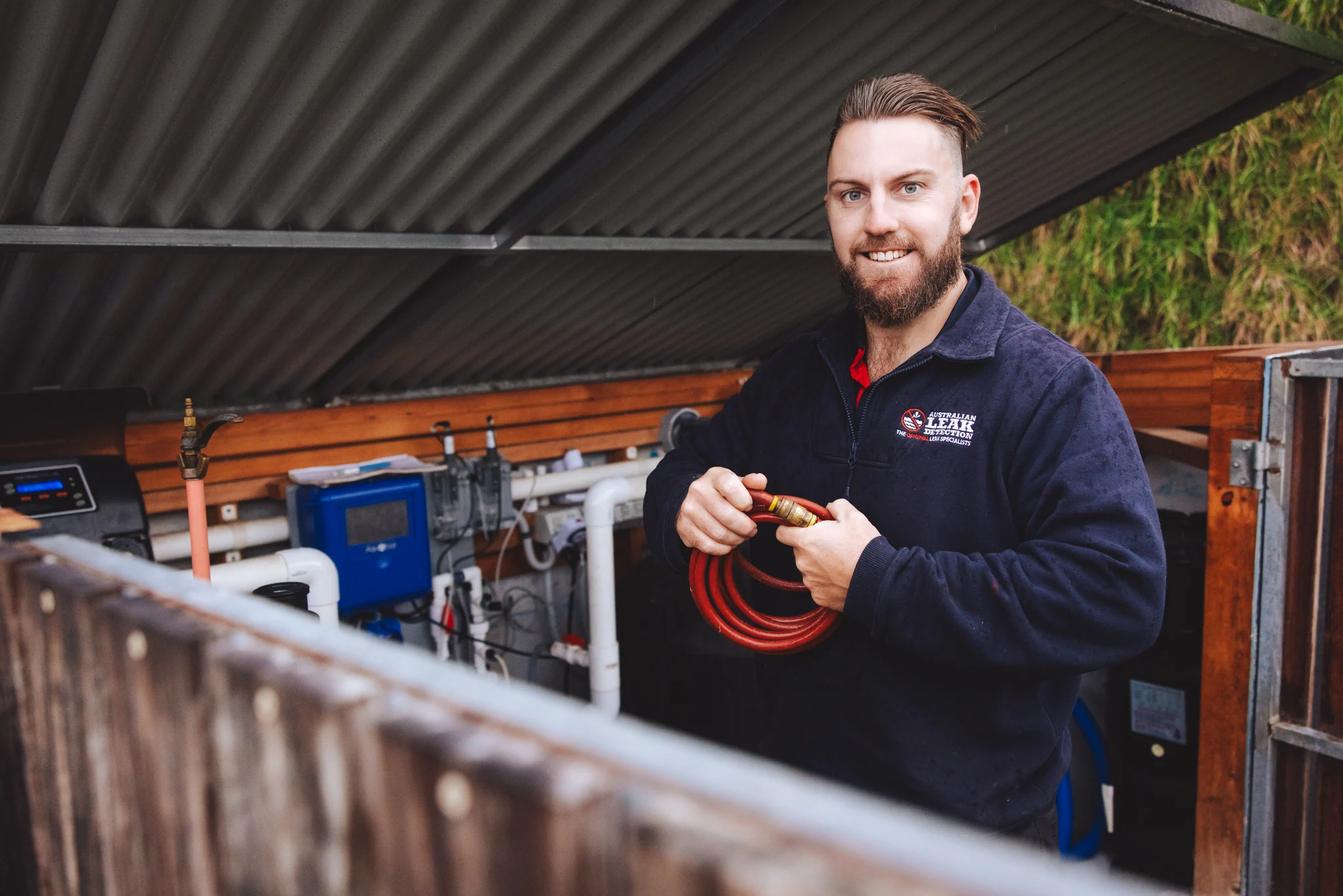 Australian Leak Detection specialist working with pool pipe testing equipment