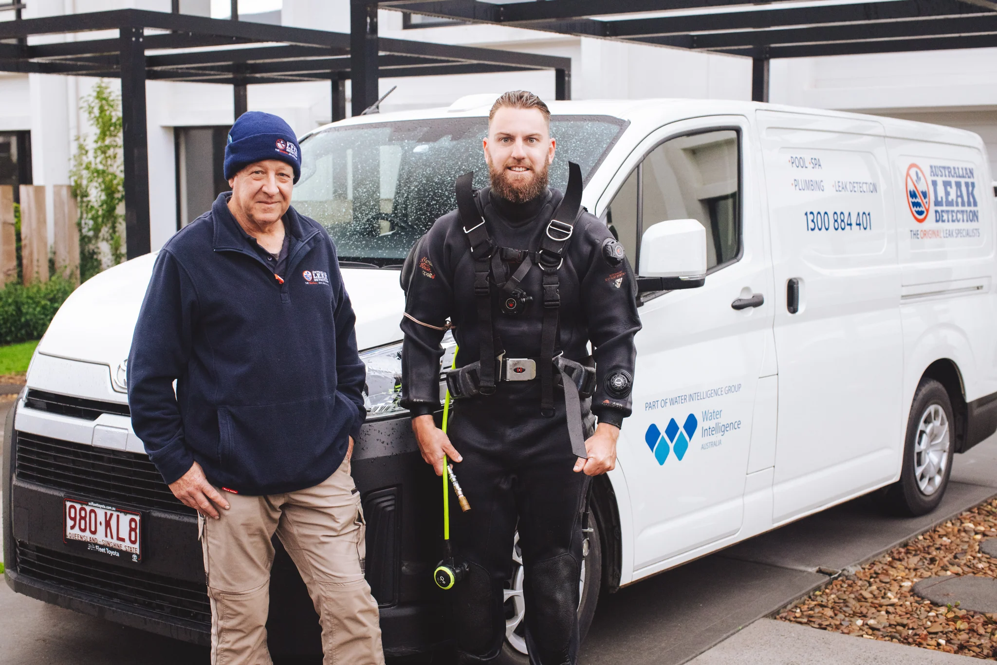 Australian Leak Detection technicians beside a current ALD service vehicle