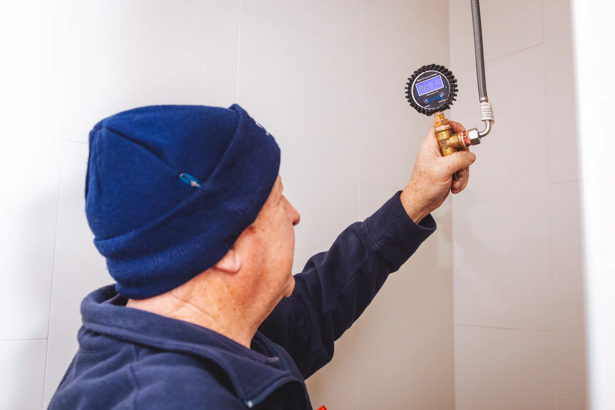 ALD specialist pressure testing an internal water line