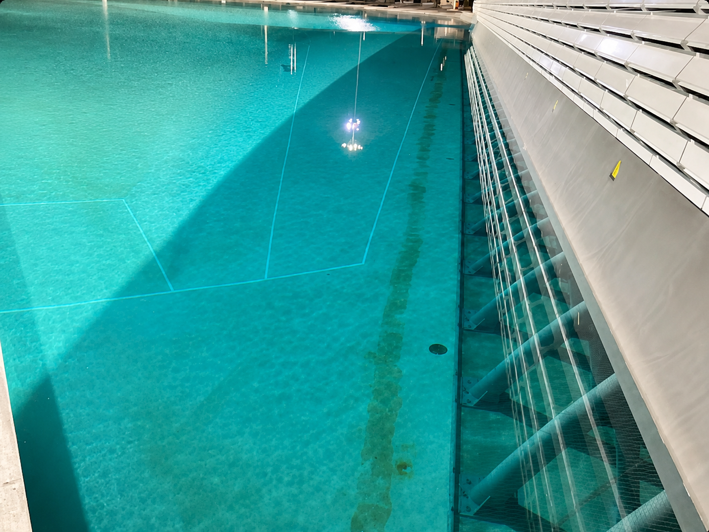 Indoor pool and spa leak detection inspection showing pool water and structure